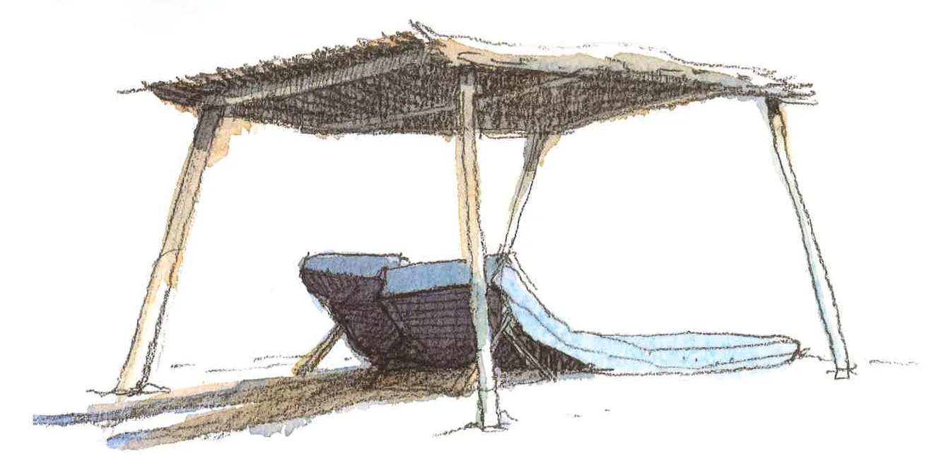 A straw hut on Club 55 beach